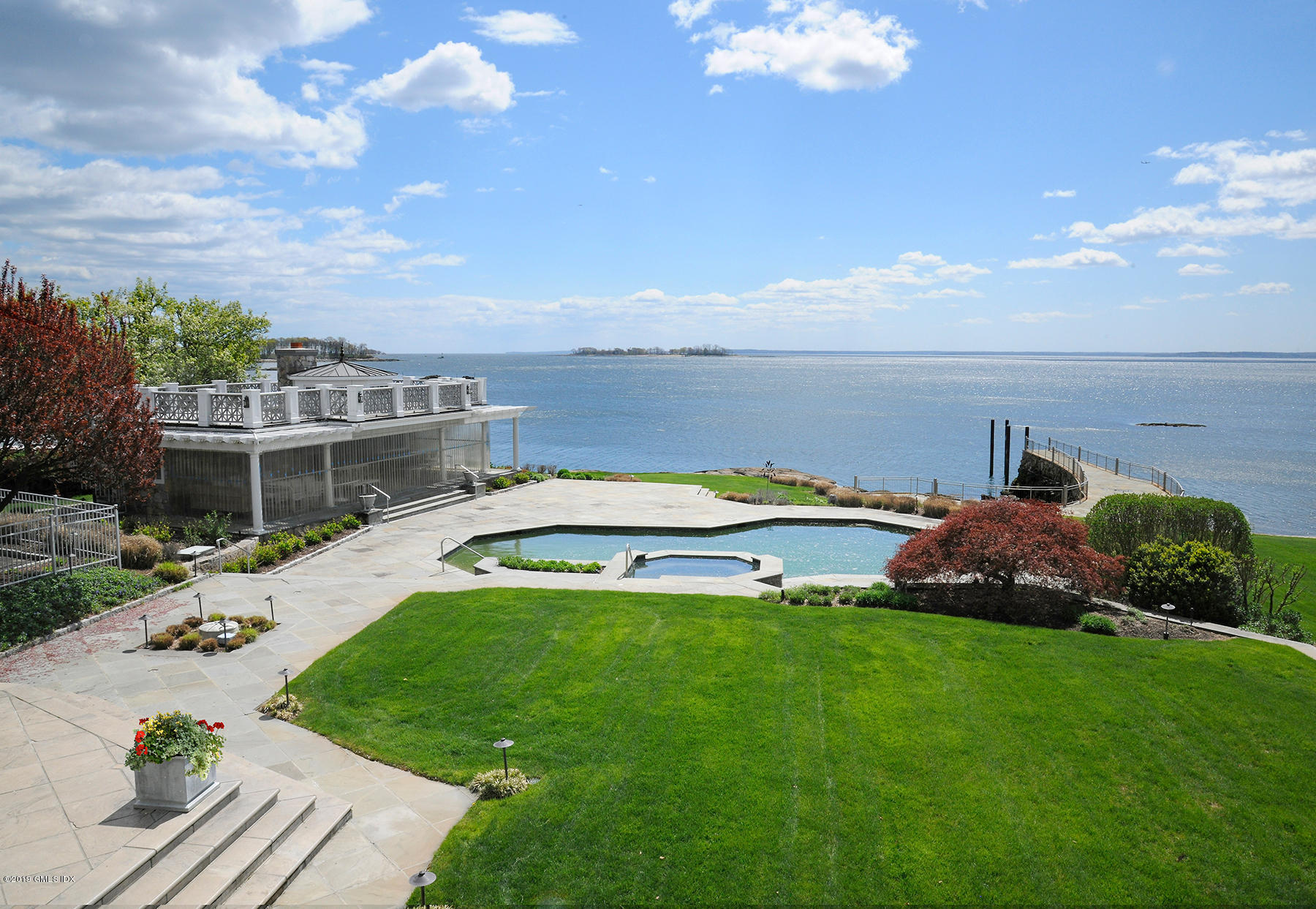 215 Byram Shore Road Greenwich, CT 06830 - Photo 20 of 26 a view of a house with a big yard