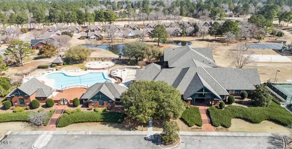 an aerial view of a house with outdoor space
