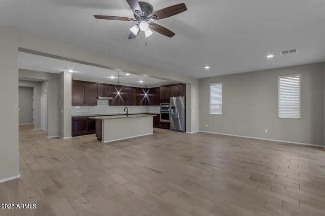a view of a kitchen with a sink and cabinet area