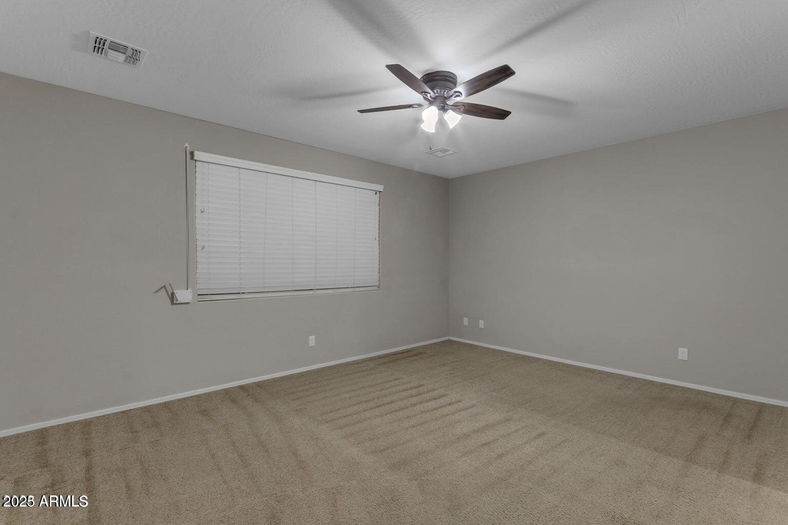 22841 South 225th Place Queen Creek, AZ 85142 - Photo 15 of 34 en empty room with windows