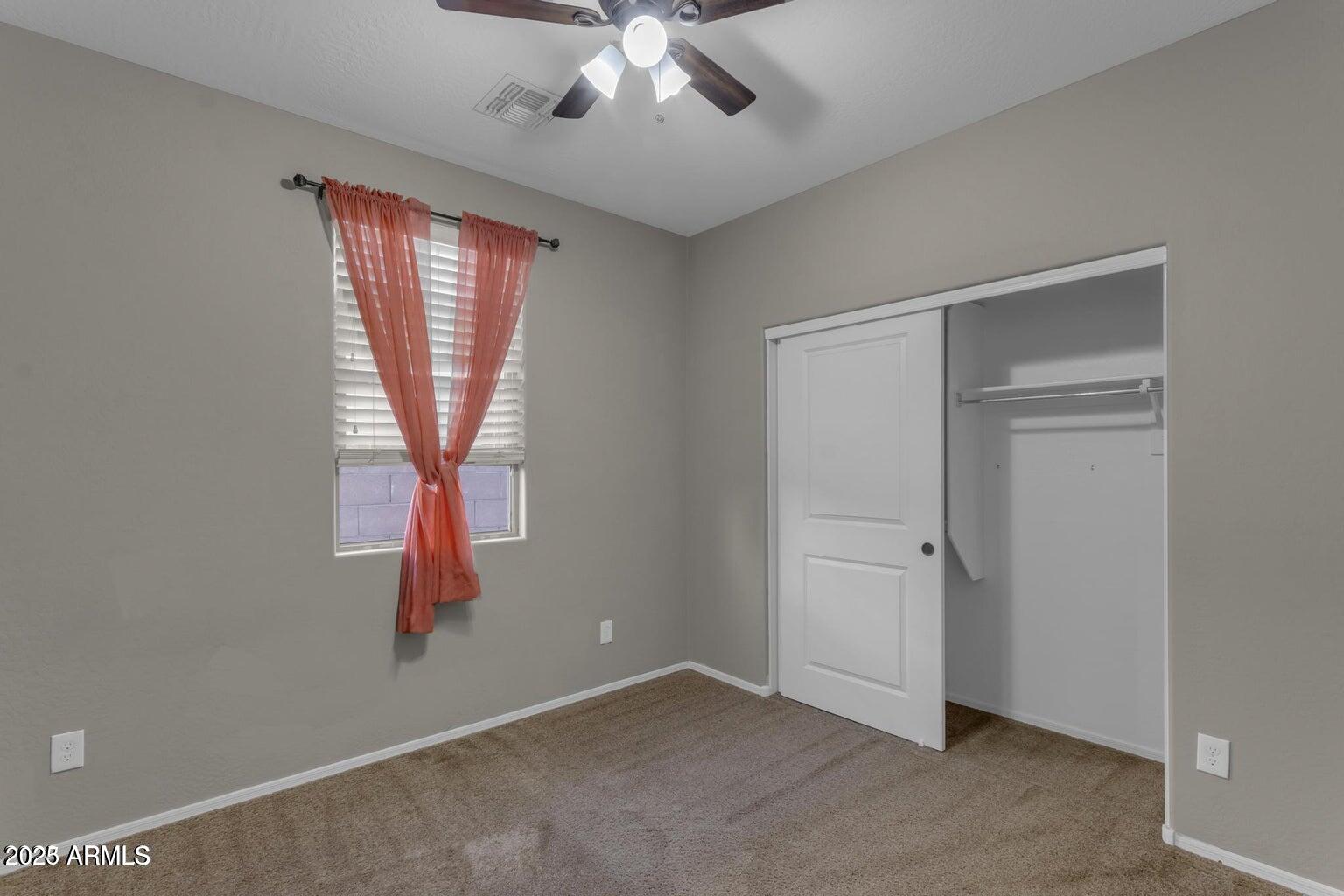 22841 South 225th Place Queen Creek, AZ 85142 - Photo 23 of 34 an empty room with chandelier fan and windows