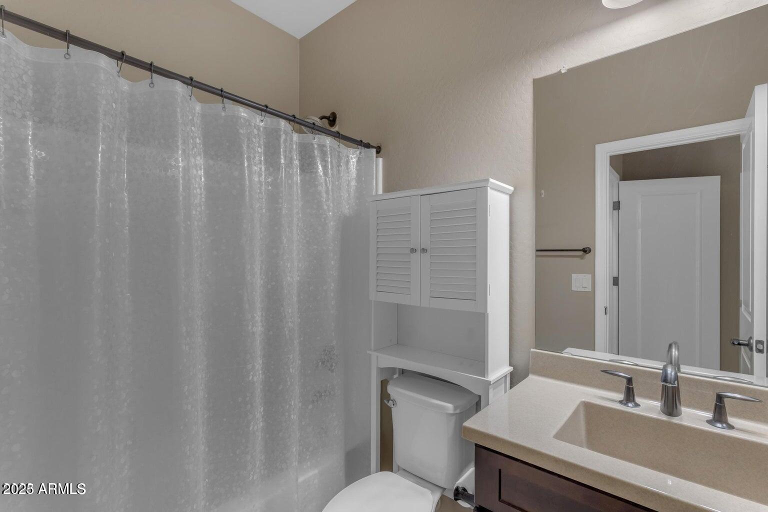 22841 South 225th Place Queen Creek, AZ 85142 - Photo 28 of 34 a bathroom with a sink and a mirror