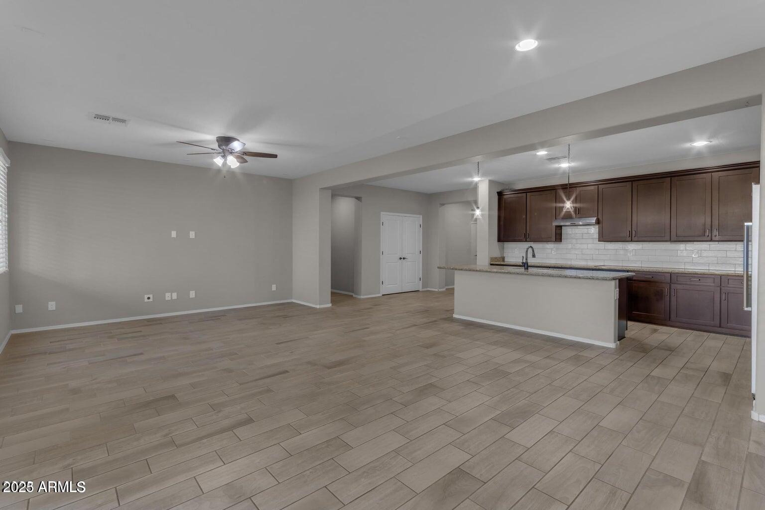 22841 South 225th Place Queen Creek, AZ 85142 - Photo 10 of 34 a view of a kitchen with a sink and cabinets