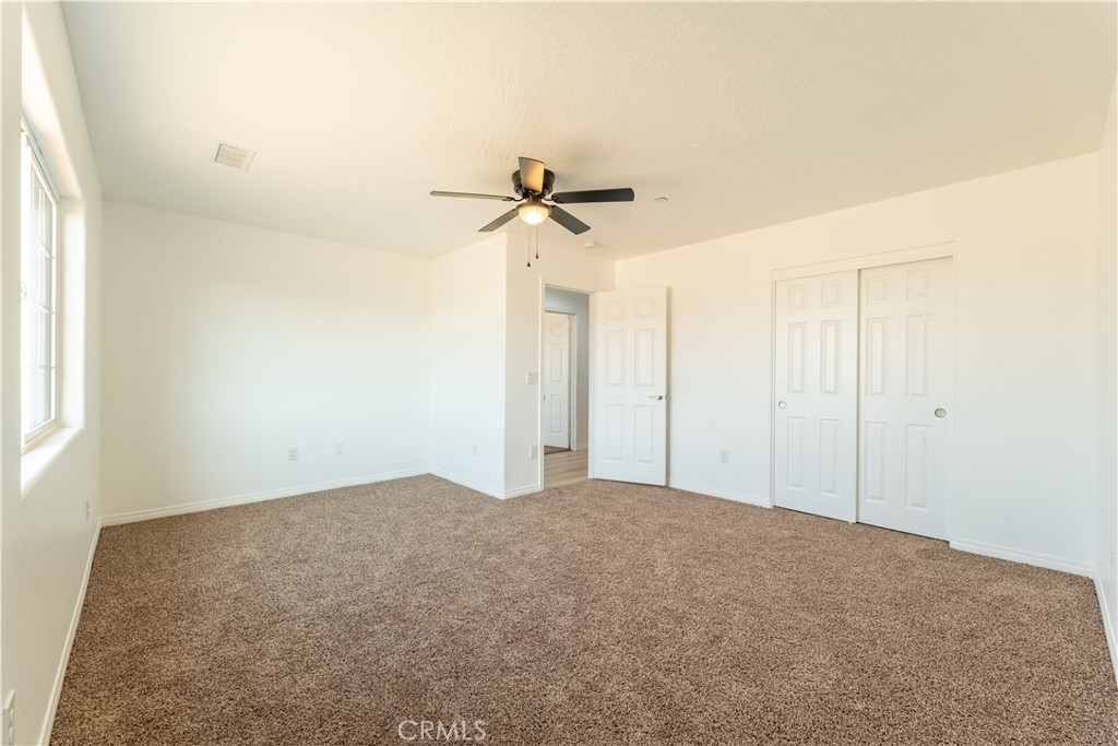 16925 Nanticoke Road Apple Valley, CA 92307 - Photo 74 of 87 a view of a big room with carpet