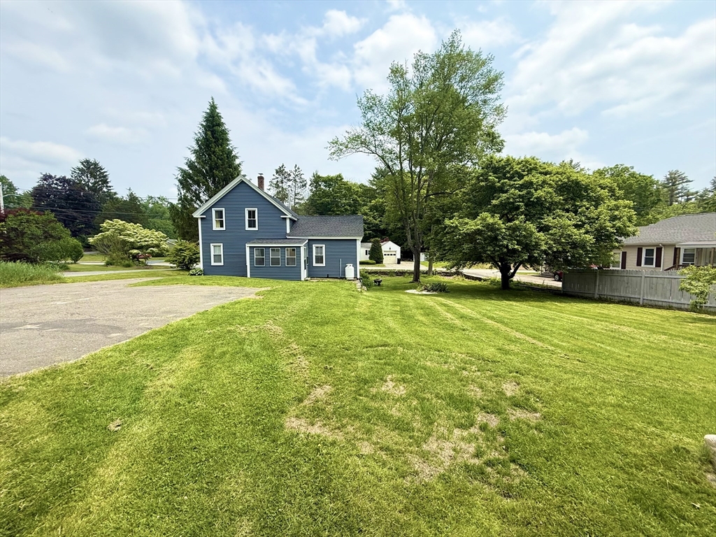 59 Brookfield Road Sturbridge, MA 01518 - Photo 11 of 40 a house view with swimming pool and trees in the background