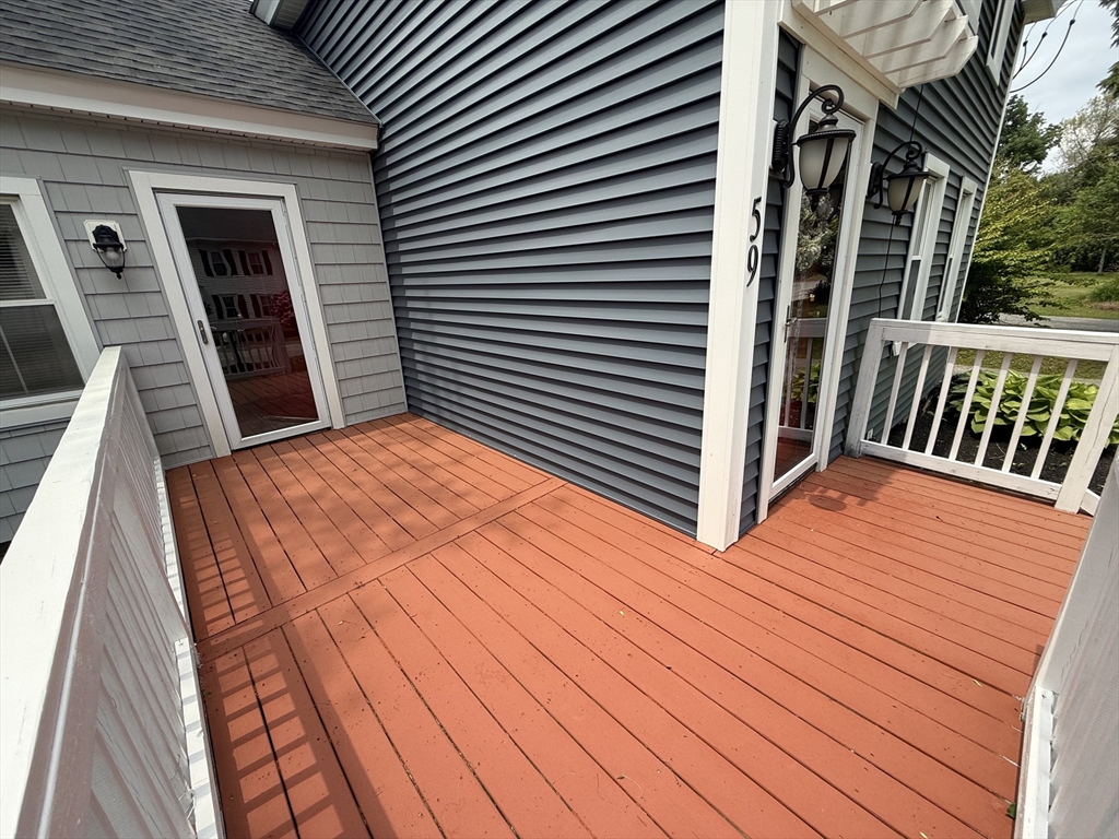 59 Brookfield Road Sturbridge, MA 01518 - Photo 14 of 40 a view of balcony with wooden floor and fence