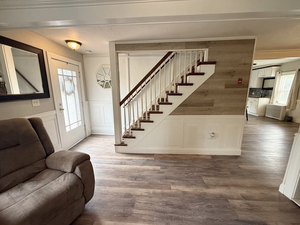 59 Brookfield Road Sturbridge, MA 01518 - Photo 24 of 40 a living room with furniture and a floor to ceiling window