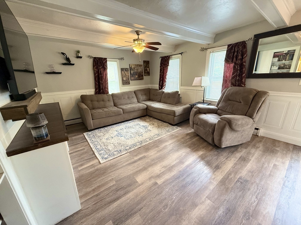 59 Brookfield Road Sturbridge, MA 01518 - Photo 25 of 40 a living room with furniture and a flat screen tv