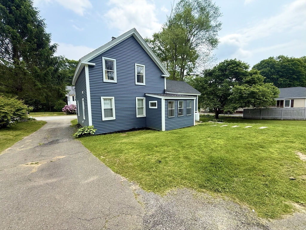 59 Brookfield Road Sturbridge, MA 01518 - Photo 7 of 40 a view of a house with a backyard