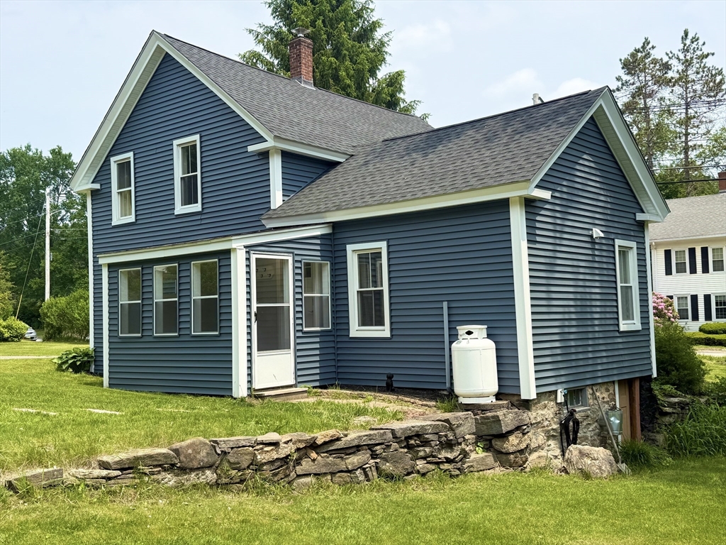59 Brookfield Road Sturbridge, MA 01518 - Photo 9 of 40 a front view of a house with a garden