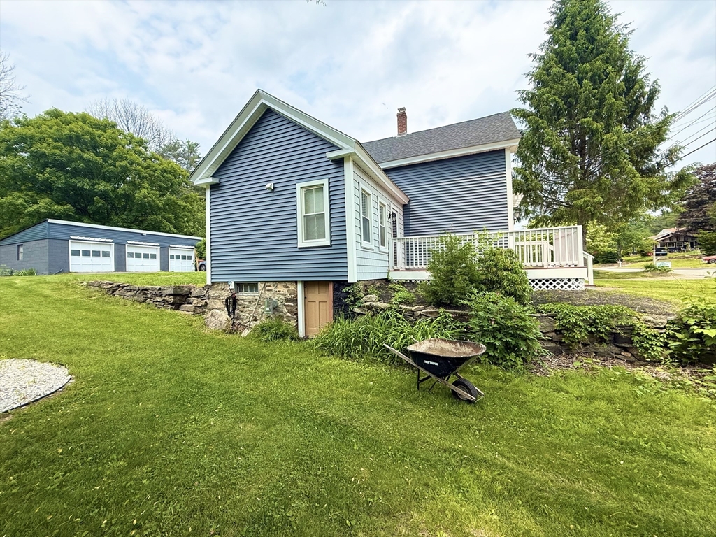 59 Brookfield Road Sturbridge, MA 01518 - Photo 10 of 40 a backyard of a house with seating space