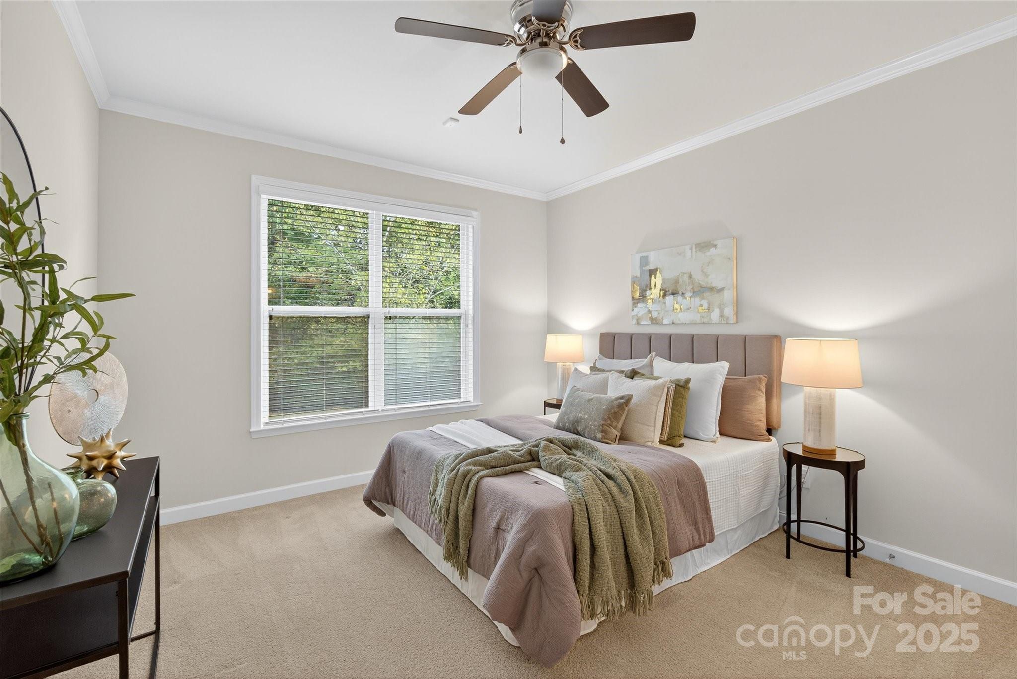 945 Vogel Way Fort Mill, SC 29715 - Photo 11 of 47 a bedroom with a bed and window