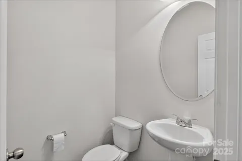 a bathroom with a toilet and a sink