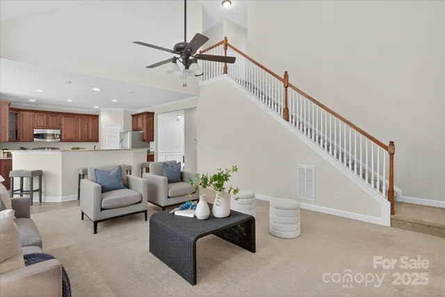 a living room with furniture or kitchen view and a potted plant