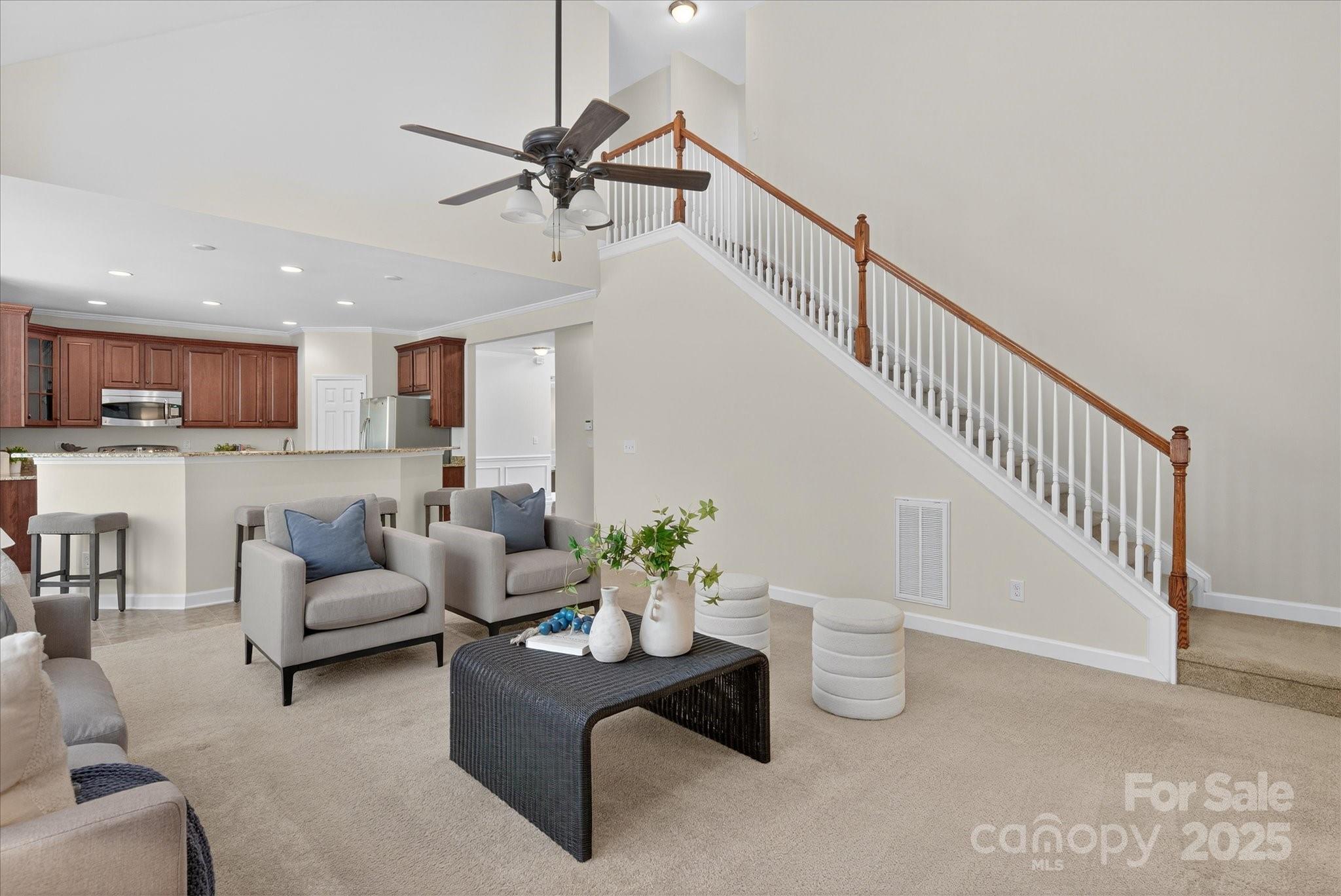 945 Vogel Way Fort Mill, SC 29715 - Photo 25 of 47 a living room with furniture or kitchen view and a potted plant