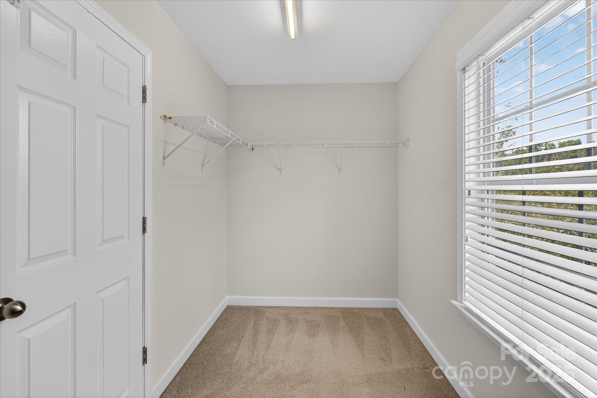 945 Vogel Way Fort Mill, SC 29715 - Photo 30 of 47 a view of an empty room with a window
