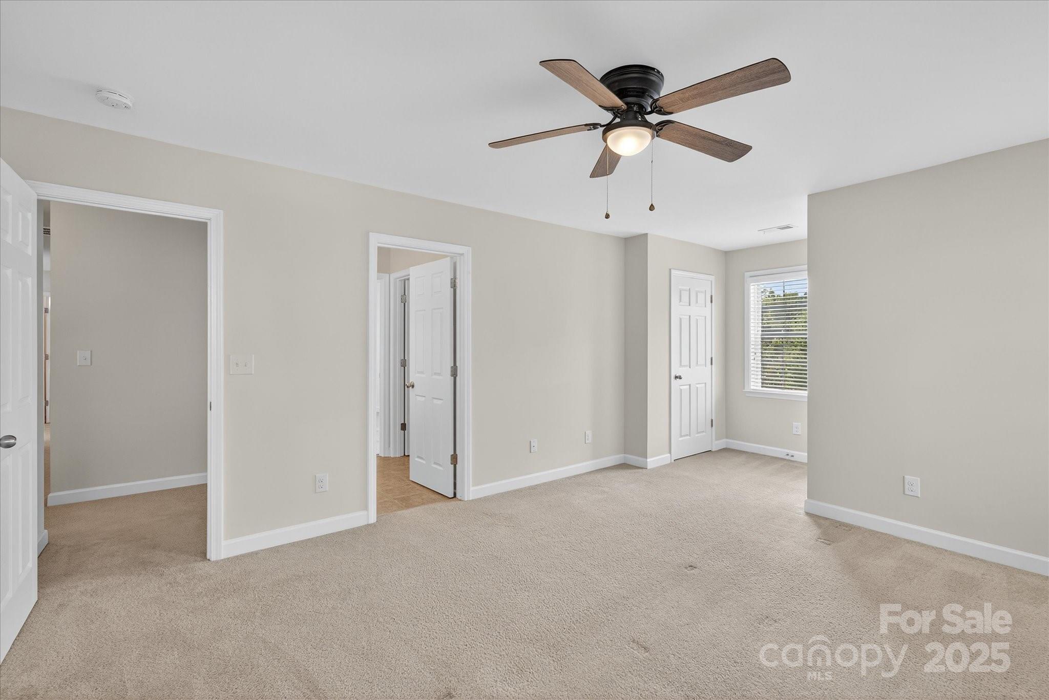 945 Vogel Way Fort Mill, SC 29715 - Photo 33 of 47 a view of an empty room with a ceiling fan