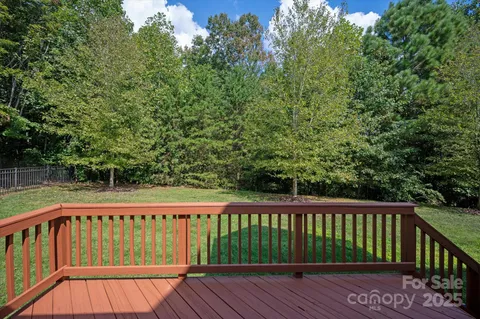 a view of balcony with wooden floor