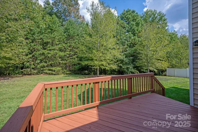a balcony with wooden floor in outdoor space