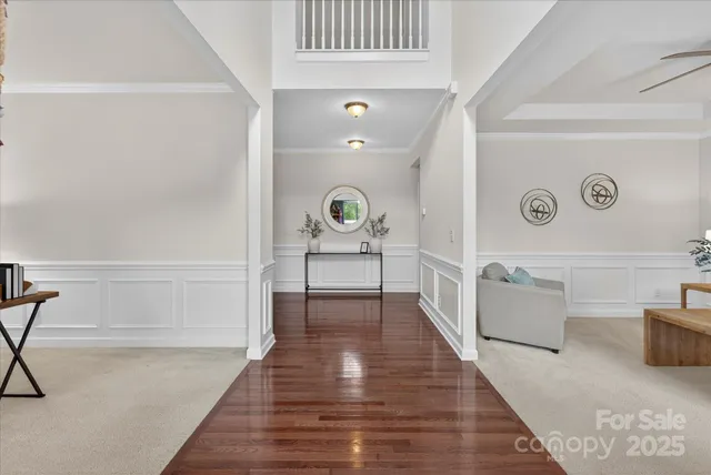 a hallway with a couch and a stove with wooden floor