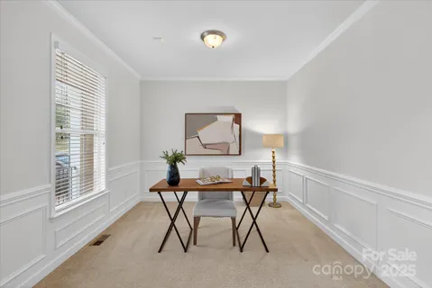 a workspace with furniture and a window