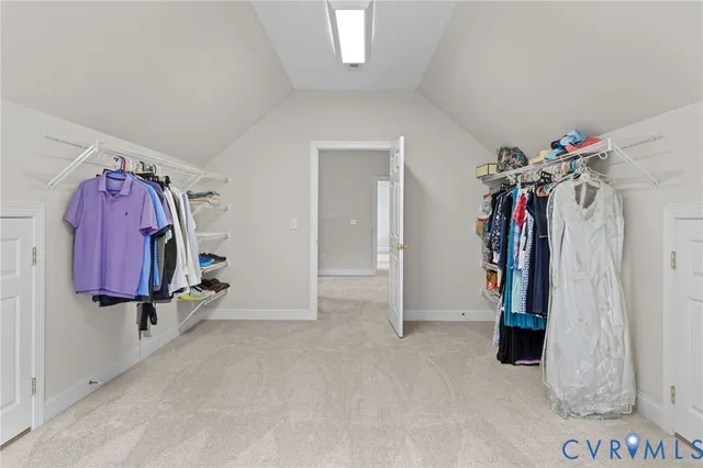 a bed room with a bed and a ceiling fan