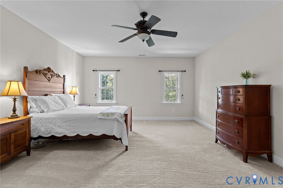 16431 River Road Chesterfield, VA 23838 - Photo 28 of 49 a bed room with a bed and a ceiling fan