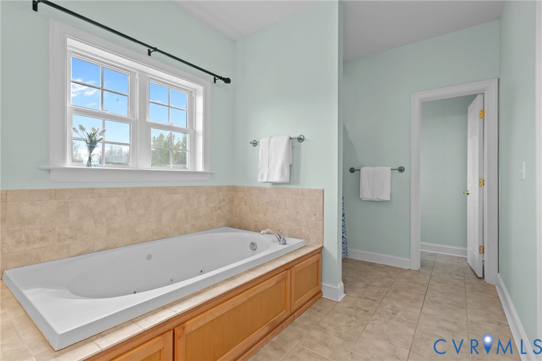 16431 River Road Chesterfield, VA 23838 - Photo 30 of 49 a bathroom with a tub and shower