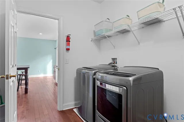 a living room with furniture and a lamp