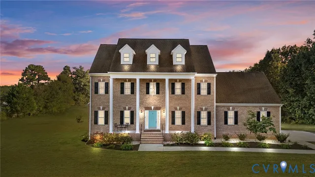 a aerial view of a house with swimming pool and sitting area