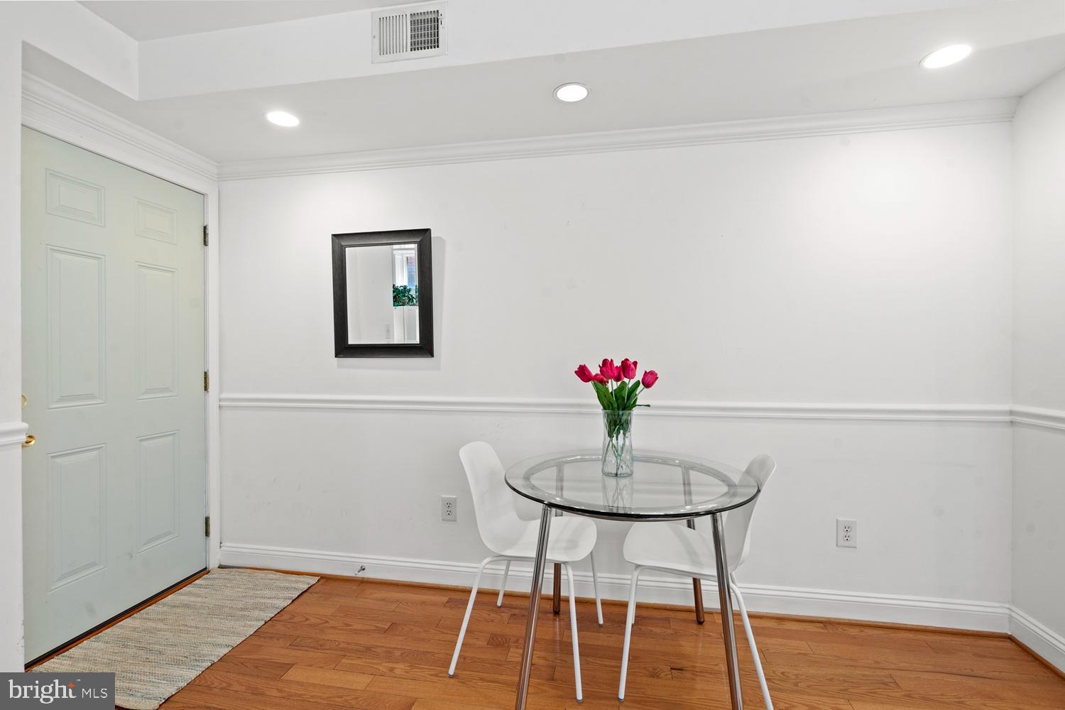 1125 12th Street Northwest, Unit 21 Washington, DC 20005 - Photo 8 of 23 a view of a room with a table and chair