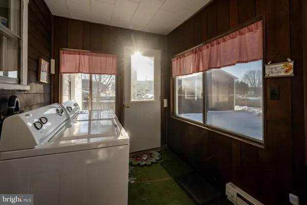 a view of a house with yard and a tree