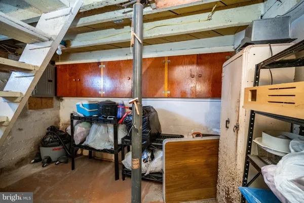a front view of a house with a yard covered with snow