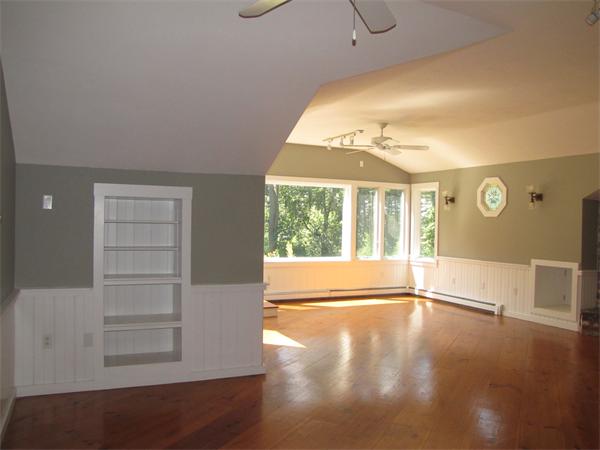 66 Harvard Road Stow, MA 01775 - Photo 15 of 30 a view of an empty room with a window and wooden floor