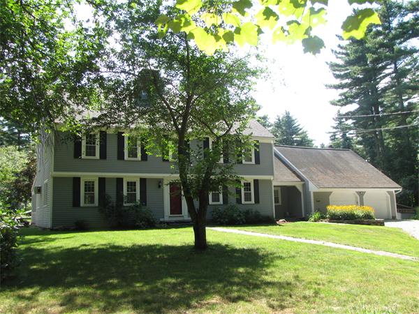 66 Harvard Road Stow, MA 01775 - Photo 2 of 30 a front view of a house with a yard