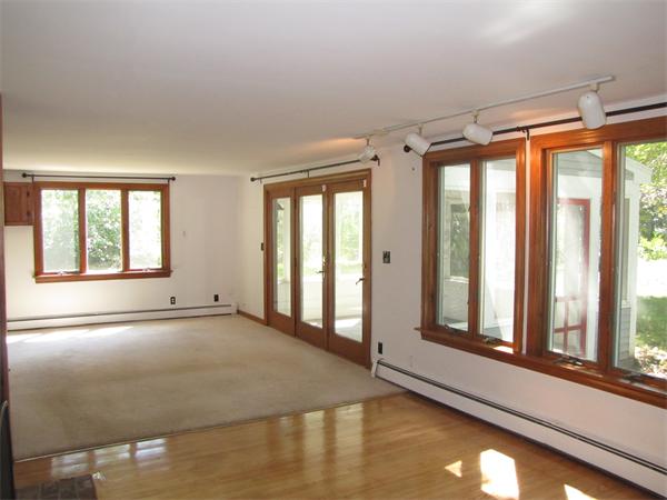 66 Harvard Road Stow, MA 01775 - Photo 5 of 30 a view of an empty room with a window