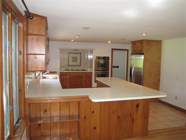 66 Harvard Road Stow, MA 01775 - Photo 9 of 30 a view of kitchen with cabinets and wooden floor