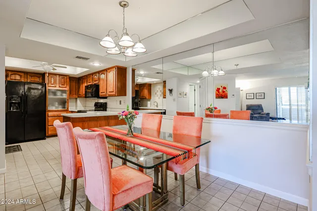 a view of a kitchen with stainless steel appliances wooden cabinets and a counter top space