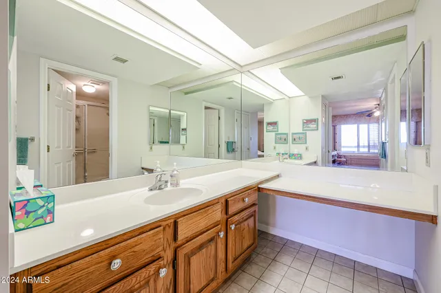 a bathroom with a tub and a sink