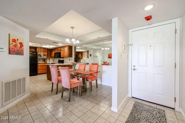 a living room with furniture a rug and a flat screen tv
