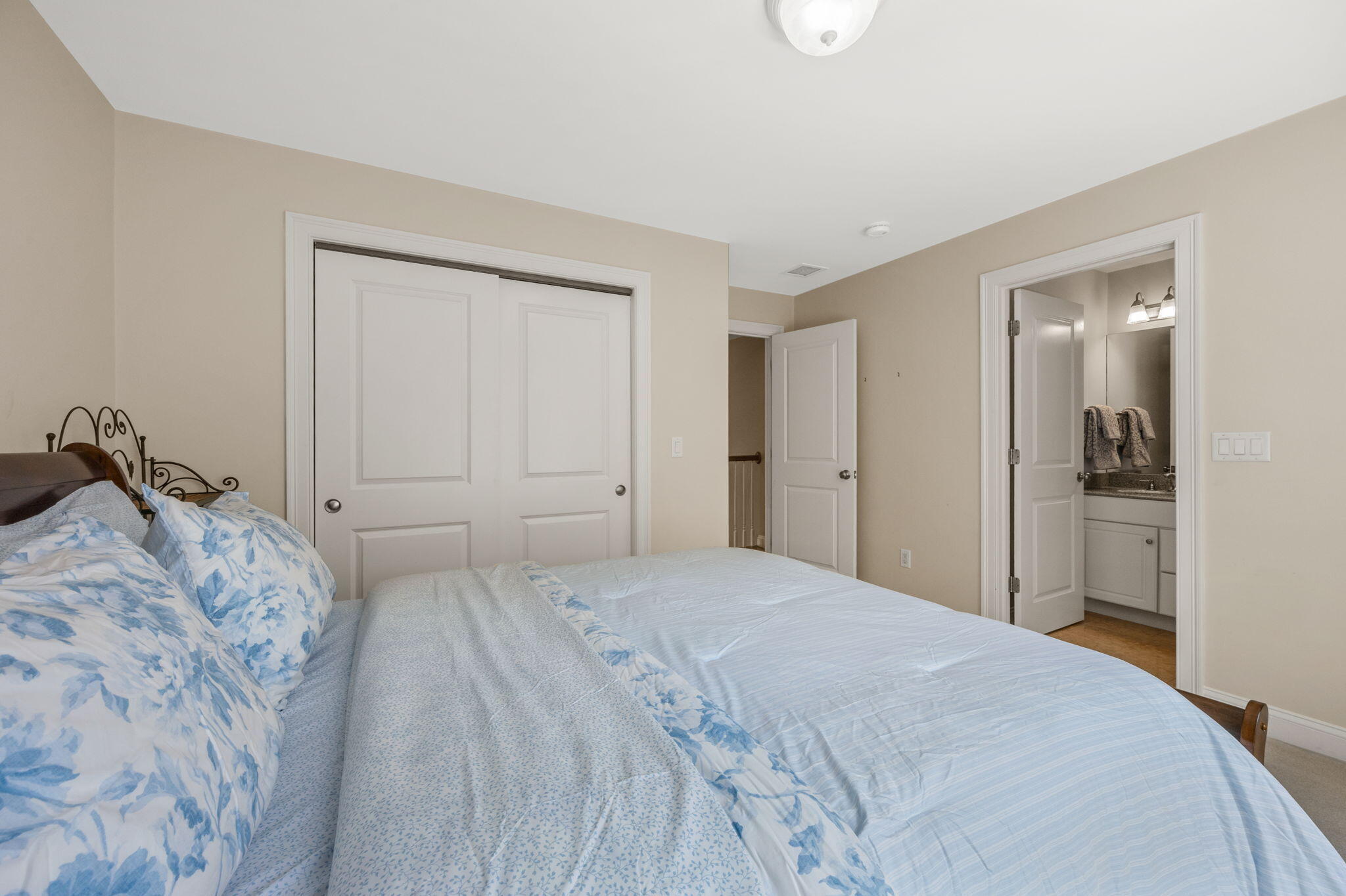 17 Payamps Road Mashpee, MA 02649 - Photo 47 of 72 a bedroom with a bed and a mirror