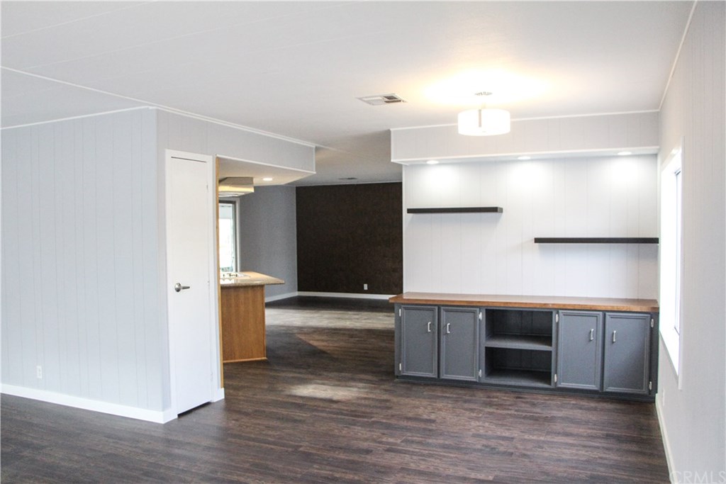 3500 Buchanan Street, Unit 6 Riverside, CA 92503 - Photo 11 of 28 a view of a kitchen with cabinets and wooden floor