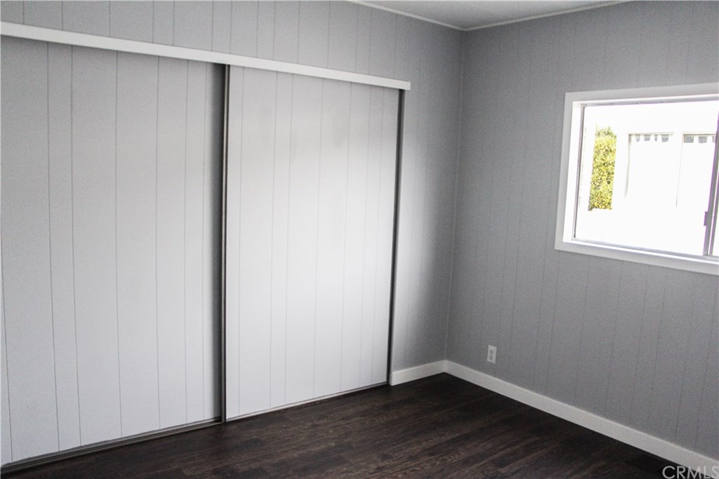 3500 Buchanan Street, Unit 6 Riverside, CA 92503 - Photo 25 of 28 an empty room with wooden floor and a window