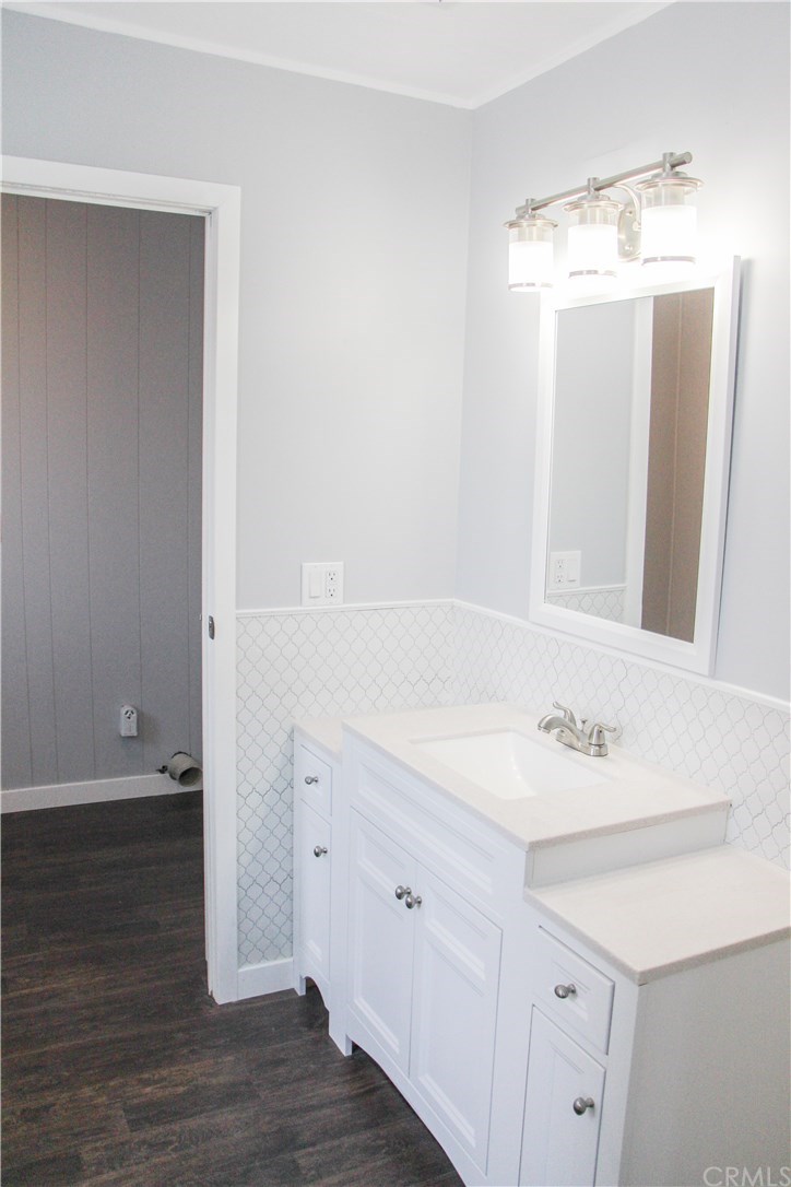 3500 Buchanan Street, Unit 6 Riverside, CA 92503 - Photo 27 of 28 a bathroom with a sink and a mirror
