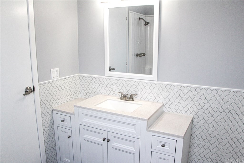 3500 Buchanan Street, Unit 6 Riverside, CA 92503 - Photo 28 of 28 a bathroom with a sink and a mirror