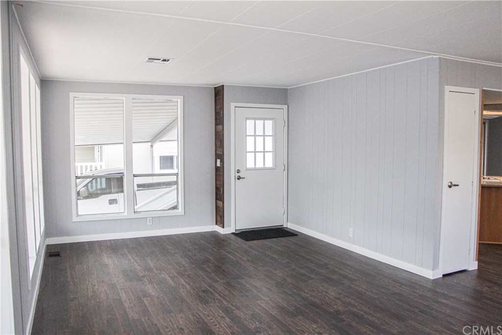 3500 Buchanan Street, Unit 6 Riverside, CA 92503 - Photo 8 of 28 an empty room with wooden floor and windows