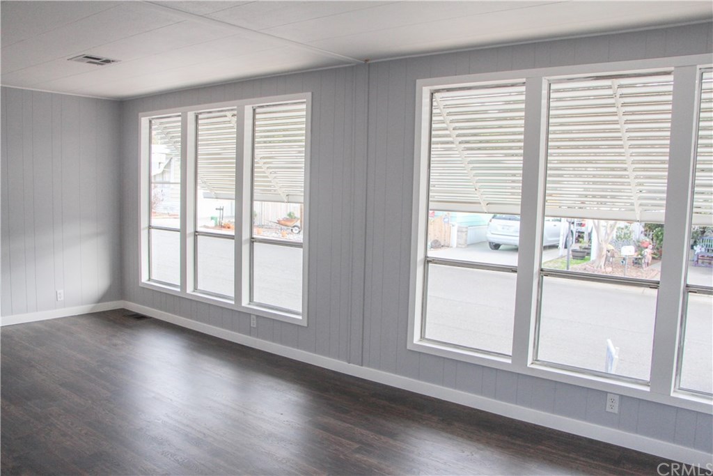 3500 Buchanan Street, Unit 6 Riverside, CA 92503 - Photo 9 of 28 a view of an empty room with wooden floor and a window