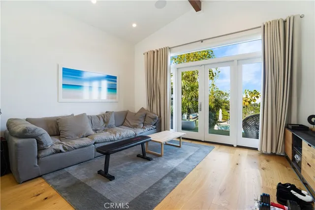 a bathroom with a double vanity sink a mirror and a bathtub