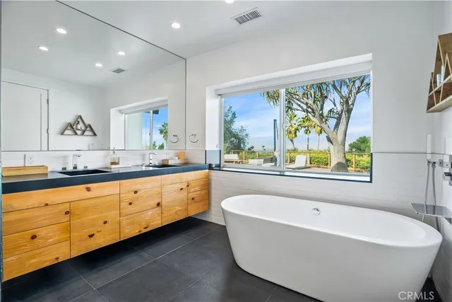 a view of a swimming pool with a table and chairs