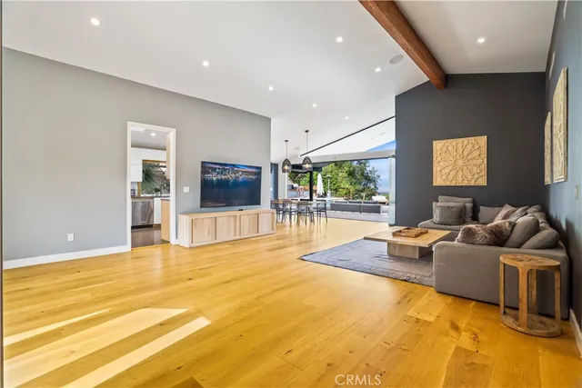 a bedroom with a bed and a large mirror